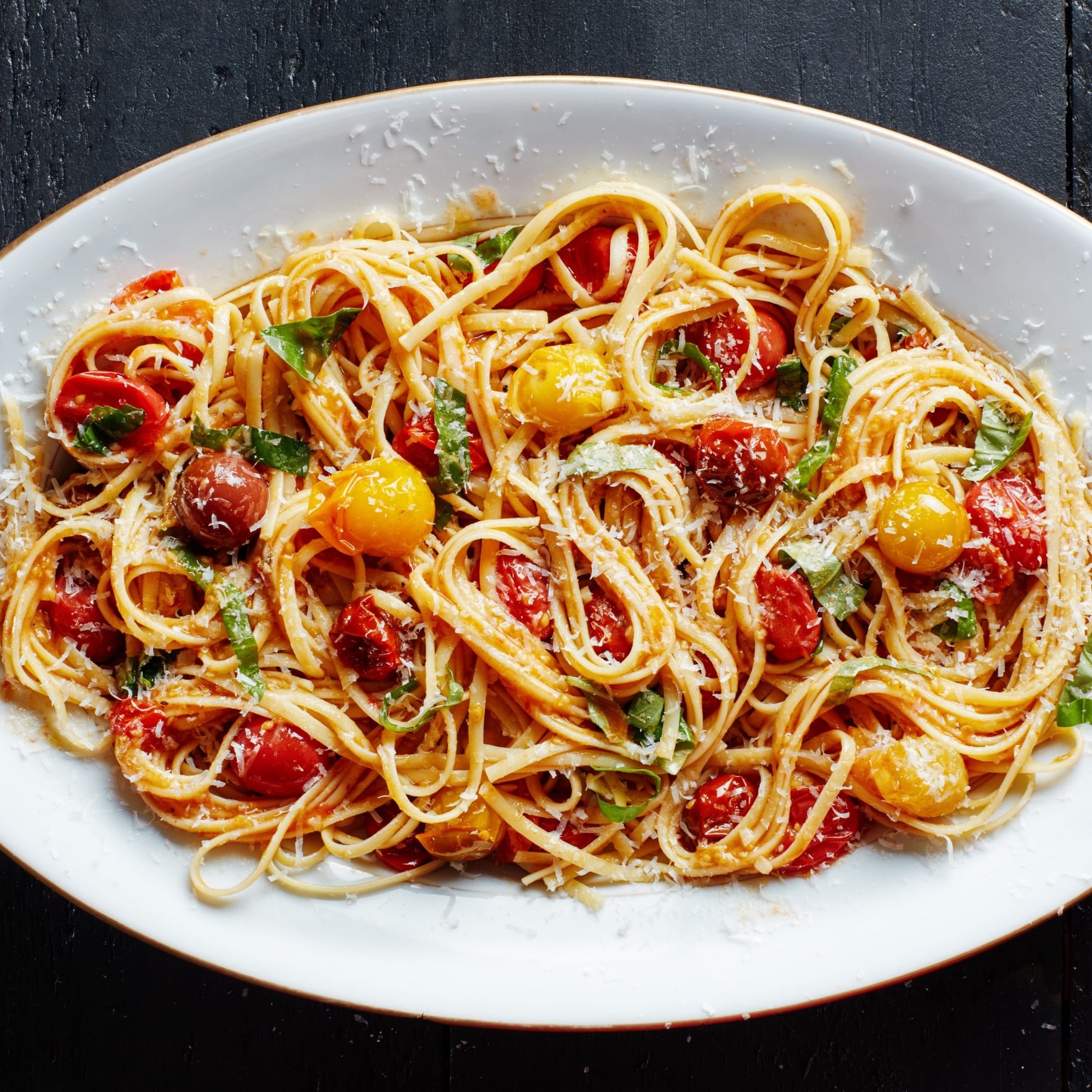 Red and yellow tomato and basil pasta