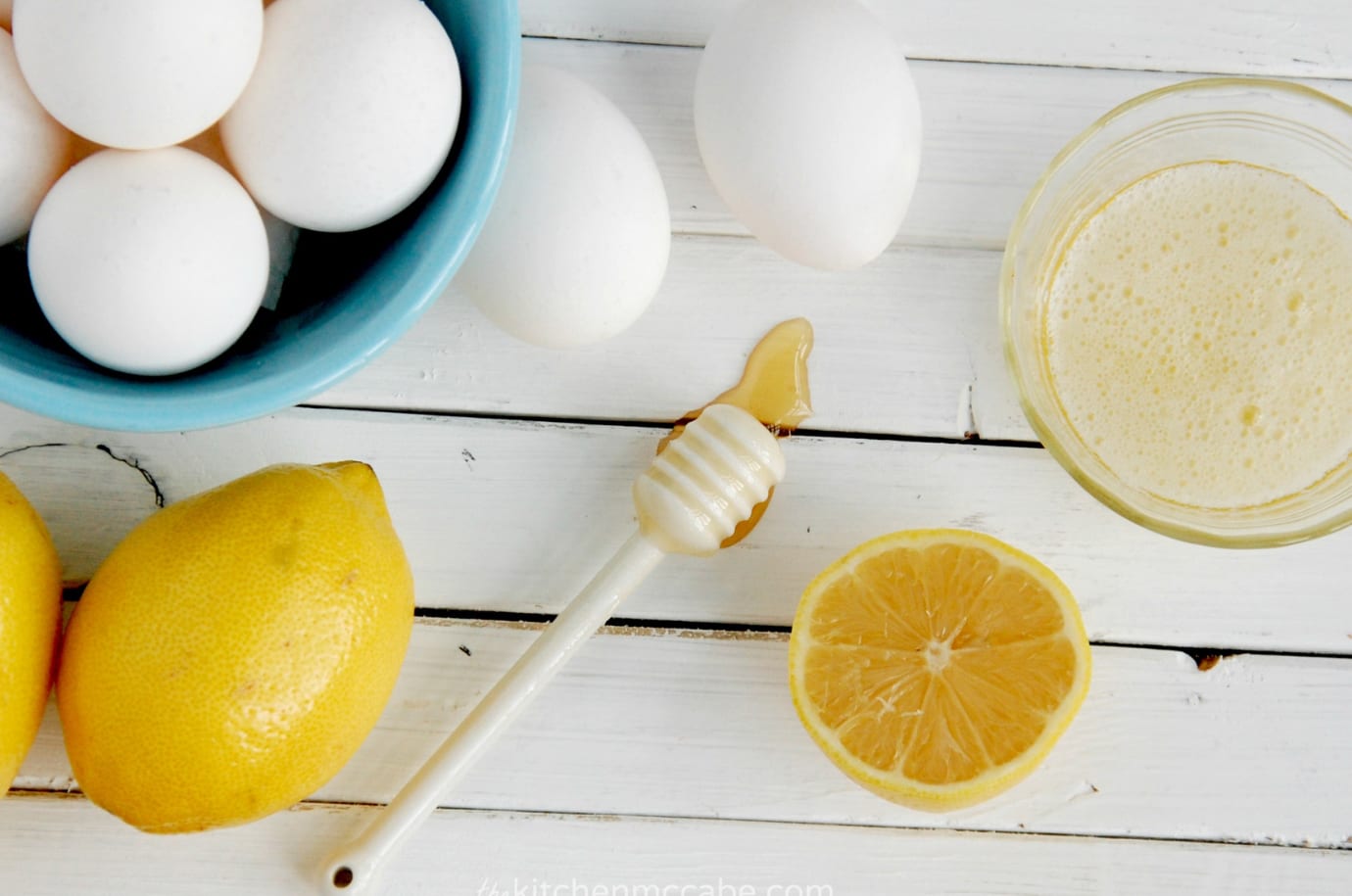 Lemon, eggs and honey on a wooden table top